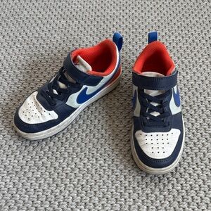 Nike Kids Navy and White Sneakers with Orange Accents
